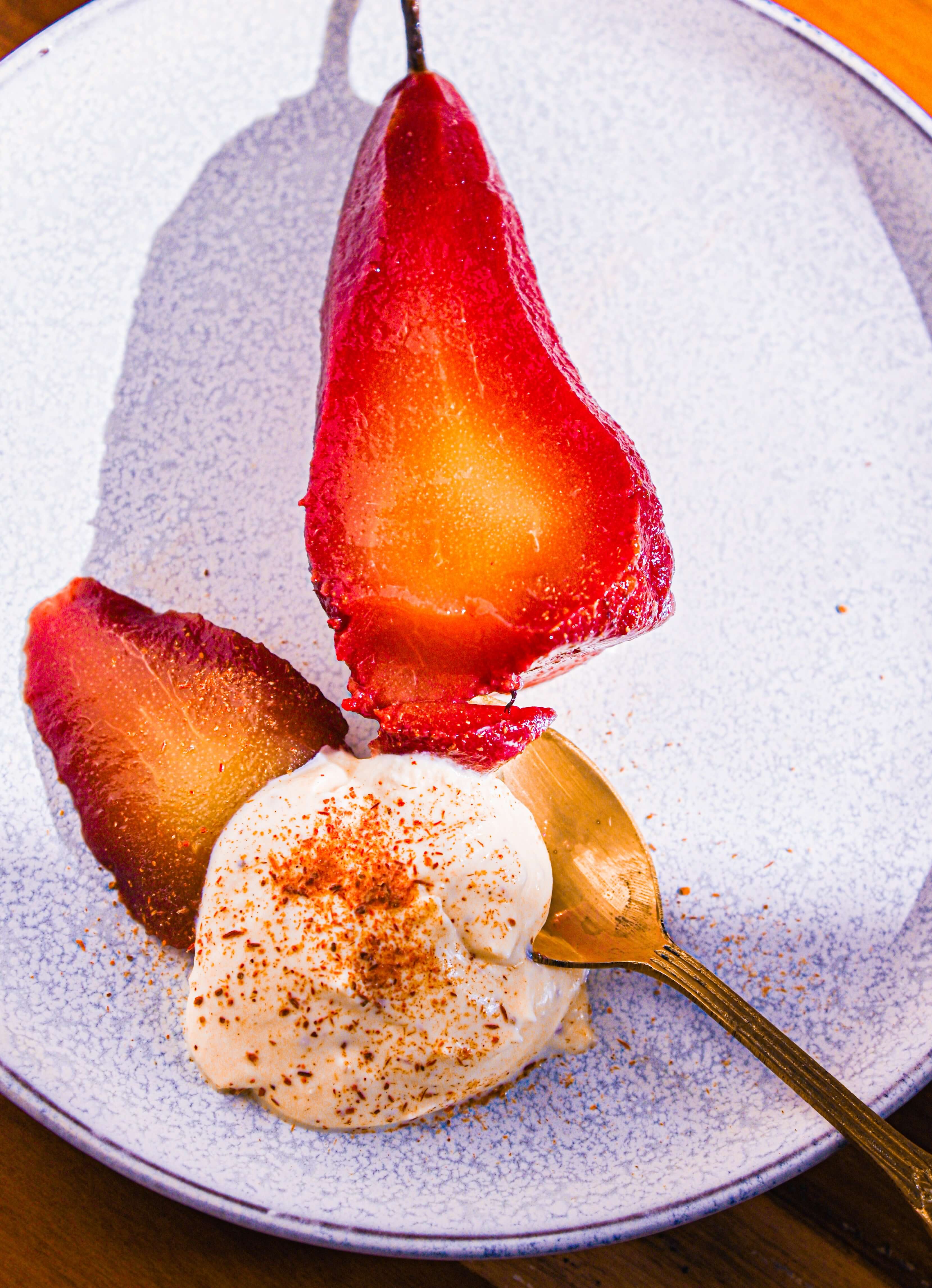 Poached Pears In Spiced Wine With Cinnamon Cream