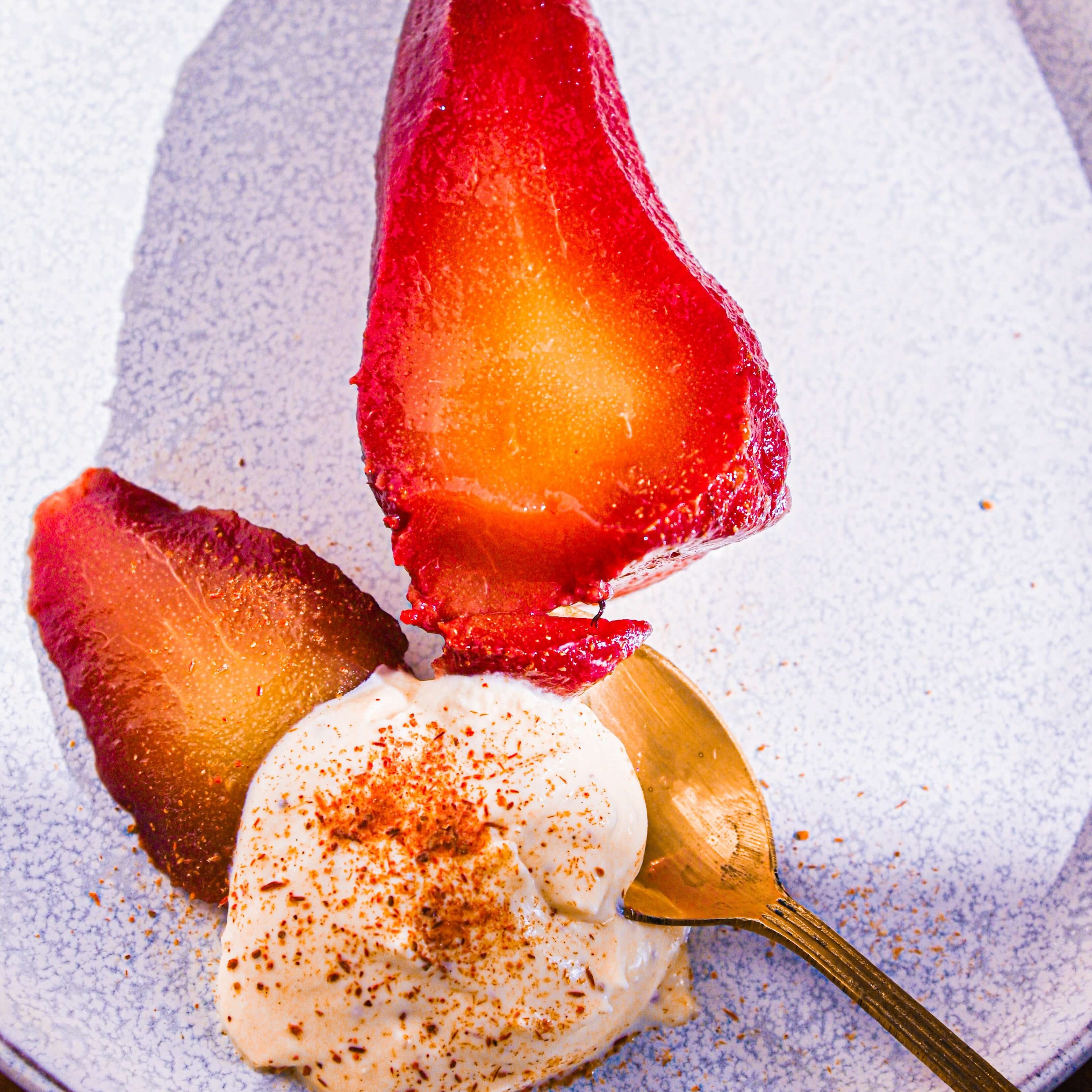 Poached Pears In Spiced Wine With Cinnamon Cream